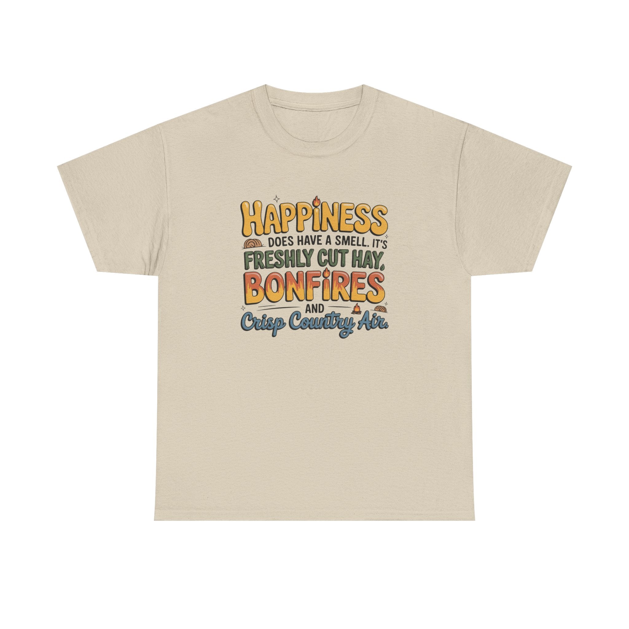 A light beige crewneck t-shirt with a graphic text print on the chest that reads 'HAPPINESS DOES HAVE A SMELL. IT'S FRESHLY CUT MAY BONFIRES AND Crisp Country Air.