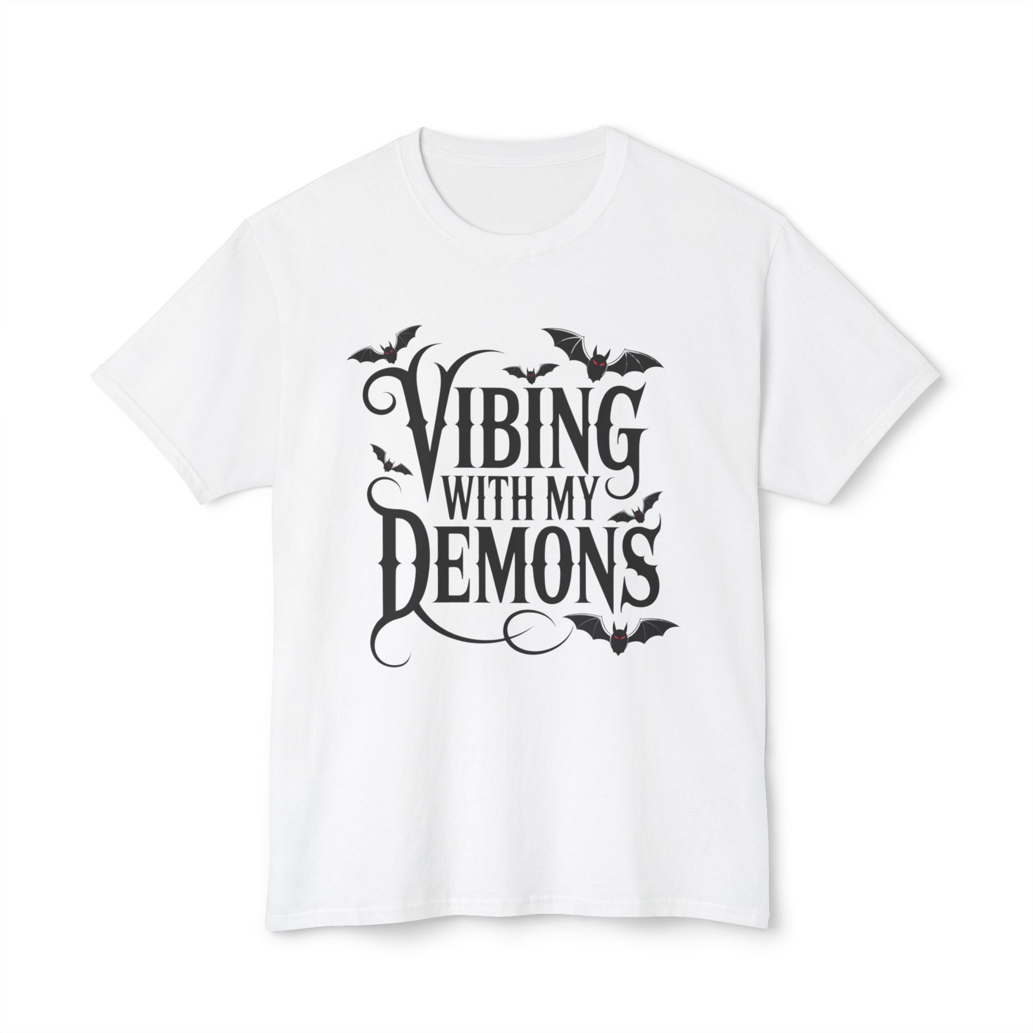 A white short-sleeve crewneck t-shirt with a black graphic print on the front that reads 'Vibing with my demons' in stylized gothic lettering, decorated with small bat silhouettes.