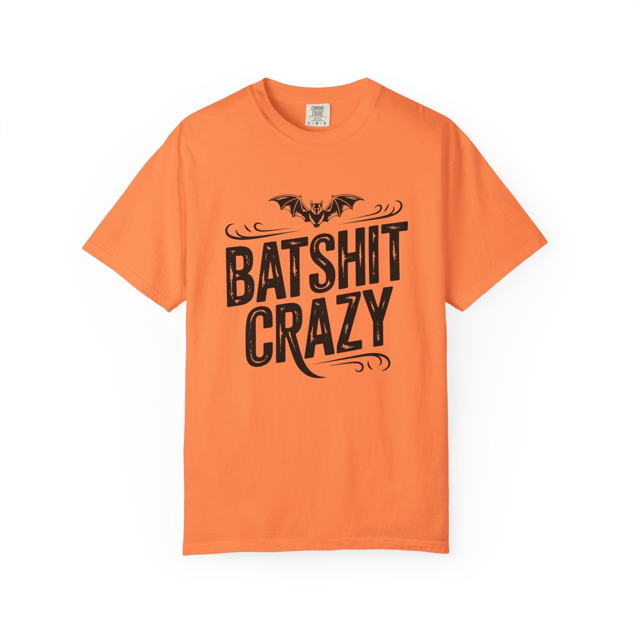 An orange short-sleeve crewneck t-shirt featuring a black graphic print of a bat above the text 'BATSHIT CRAZY' with decorative flourishes, displayed on a clean white background.