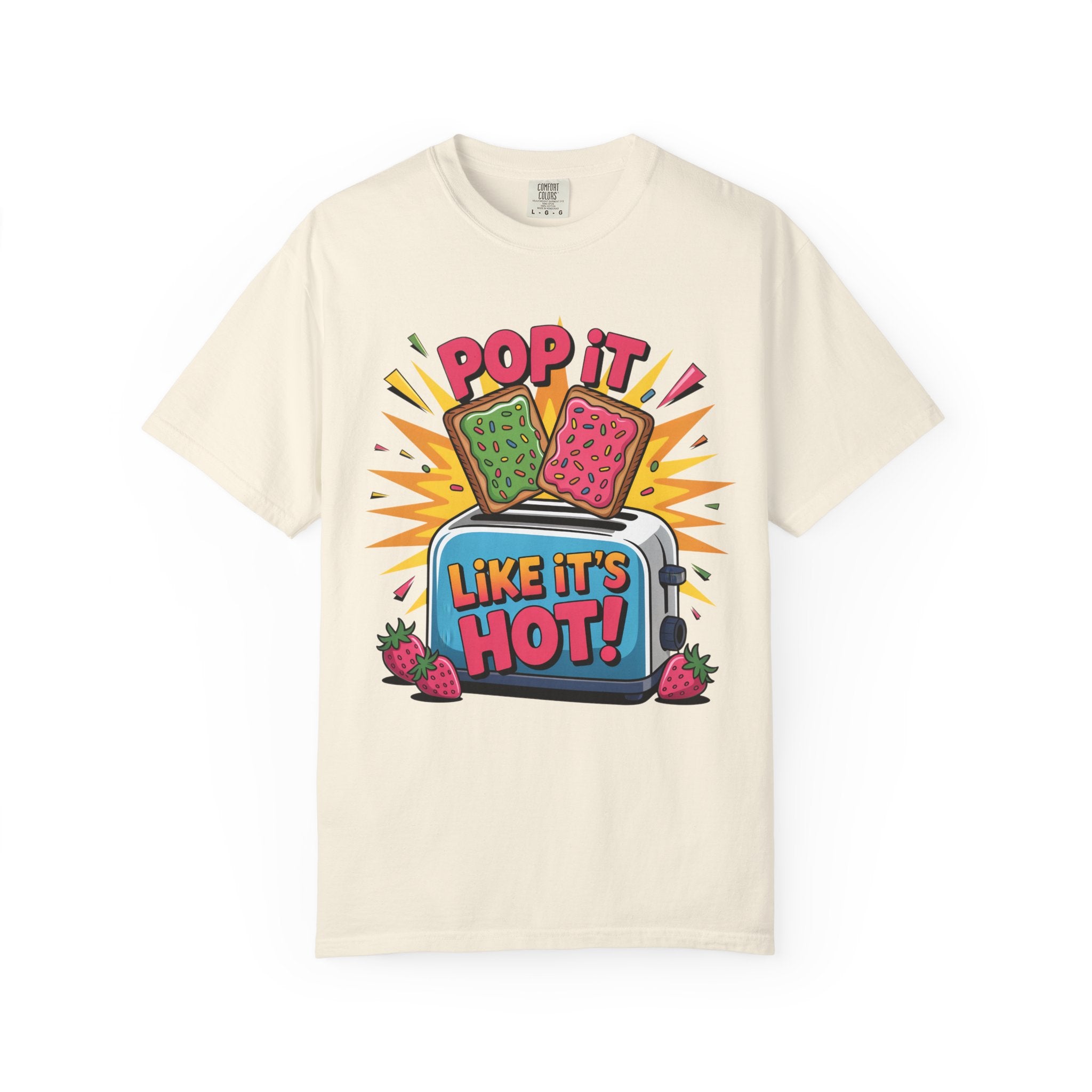 An off-white short-sleeve t-shirt with a colorful retro graphic on the front. The graphic features two Pop-Tarts popping out of a blue toaster with the text 'POP IT LIKE IT'S HOT!' and 'LIKE IT'S HOT!' in bold letters, surrounded by strawberry illustrations and yellow starburst shapes.