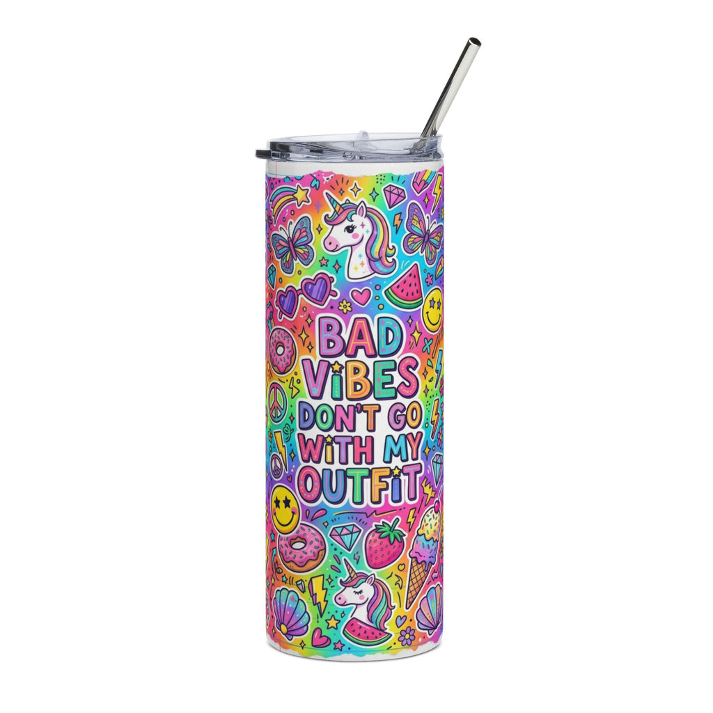 A tall, skinny tumbler with a clear lid and metal straw, decorated with a vibrant, colorful cartoon pattern of unicorns, butterflies, strawberries, and the text 'BAD VIBES DON'T GO WITH MY OUTFIT'.