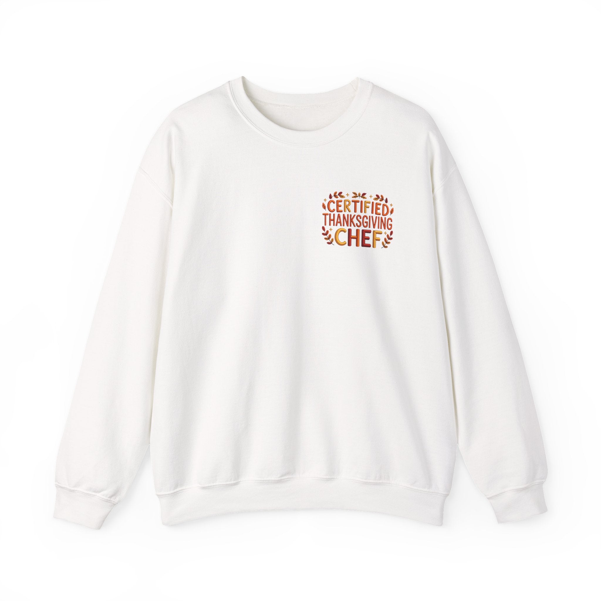A white crewneck sweatshirt with a small graphic on the left chest that reads 'CERTIFIED THANKSGIVING CHEF' in orange and brown tones, displayed on a clean white background.