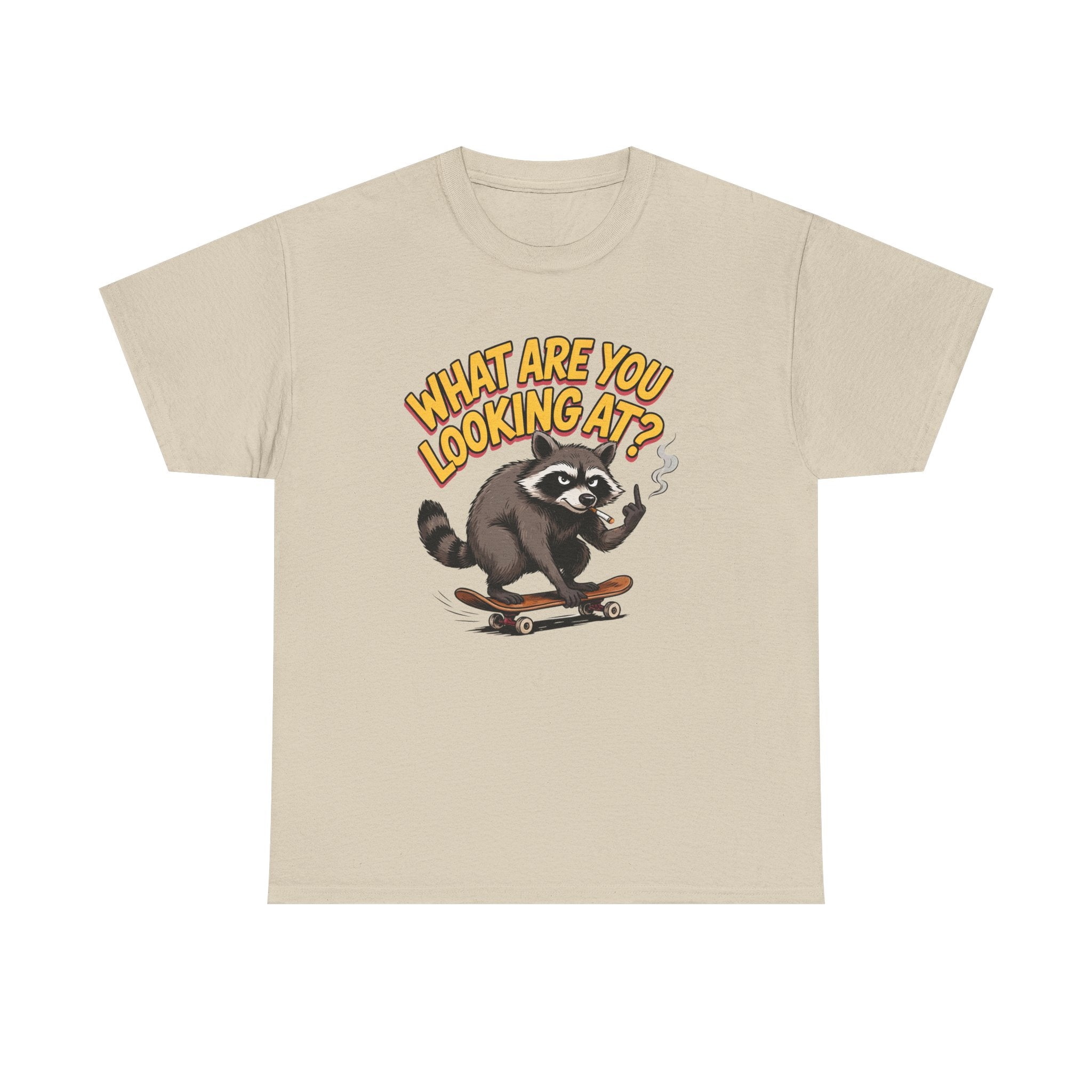 A light beige crewneck t-shirt featuring a cartoon graphic of a raccoon wearing sunglasses and smoking a cigarette, with the text 'WHAT ARE YOU LOOKING AT?' in yellow above it.