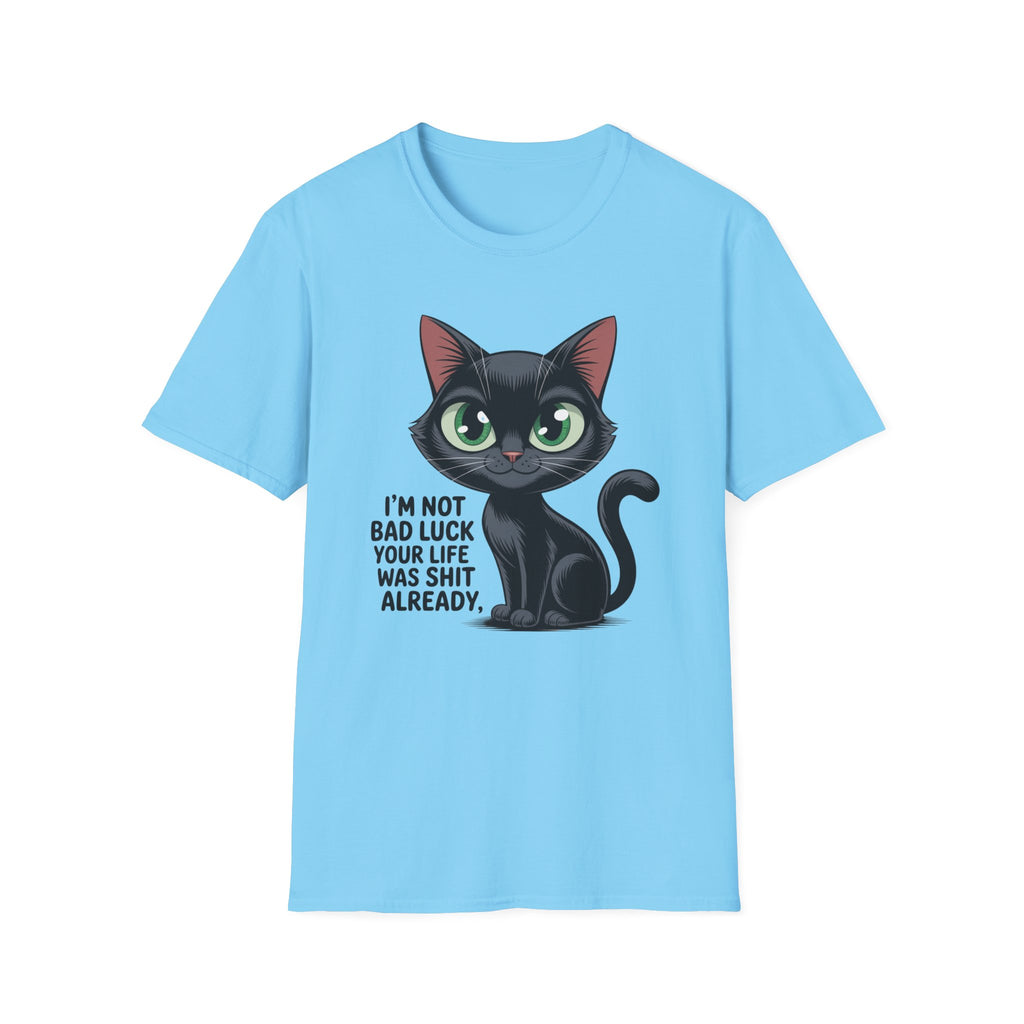 A light blue short-sleeve t-shirt featuring a cartoon graphic of a black cat with green eyes and the text 'I'M NOT BAD LUCK YOUR LIFE WAS SHIT ALREADY.' printed on the front, displayed against a solid white background.
