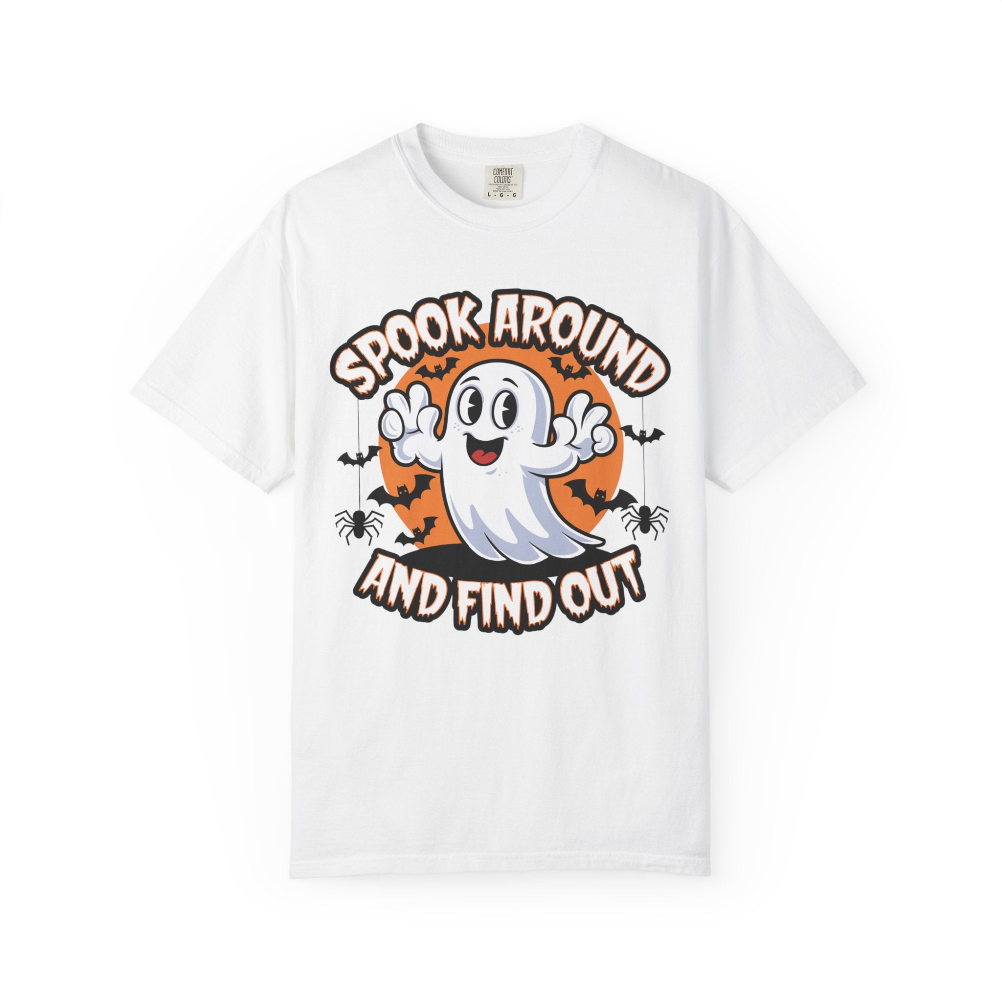 A white short-sleeve crewneck t-shirt featuring a Halloween graphic on the front with a cartoon ghost, an orange full moon, bats, spiders, and the text 'SPOOK AROUND AND FIND OUT'.