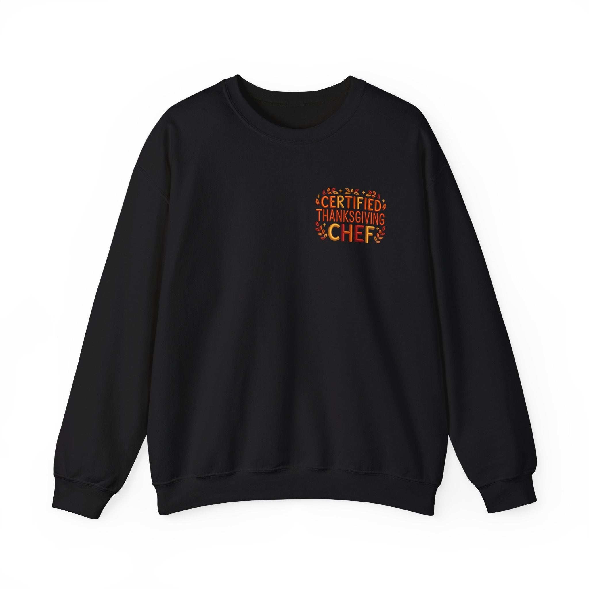 A black crewneck sweatshirt with a small graphic on the left chest that reads 'CERTIFIED THANKSGIVING CHEF' in orange and yellow text with a turkey illustration, shown on a plain white background.