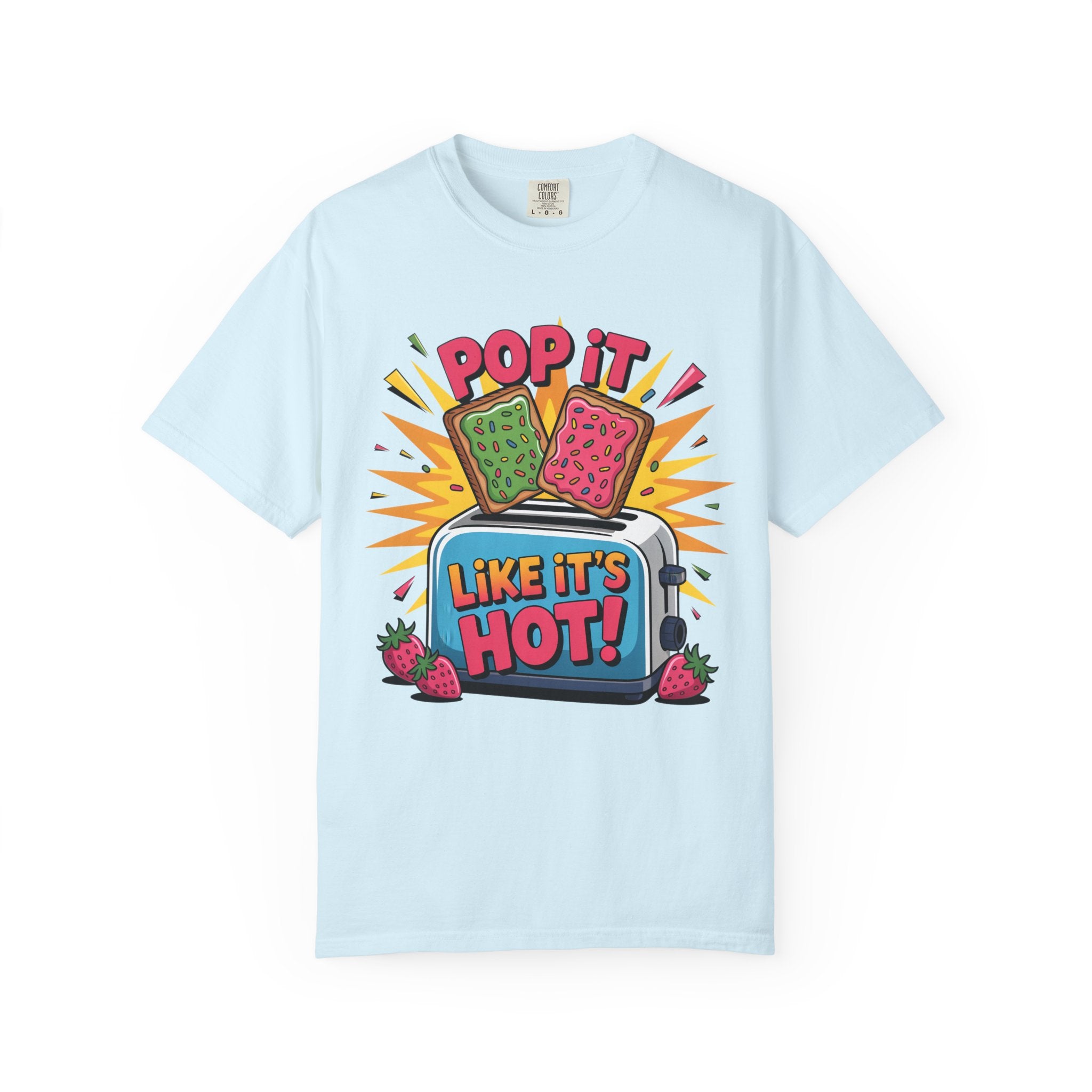 A light blue short-sleeve t-shirt with a colorful graphic print on the front. The graphic features two popsicles popping out of a toaster with the text 'POP IT LIKE IT'S HOT!' and 'LIKE IT'S HOT!' in bold letters, surrounded by strawberries and yellow starburst shapes.