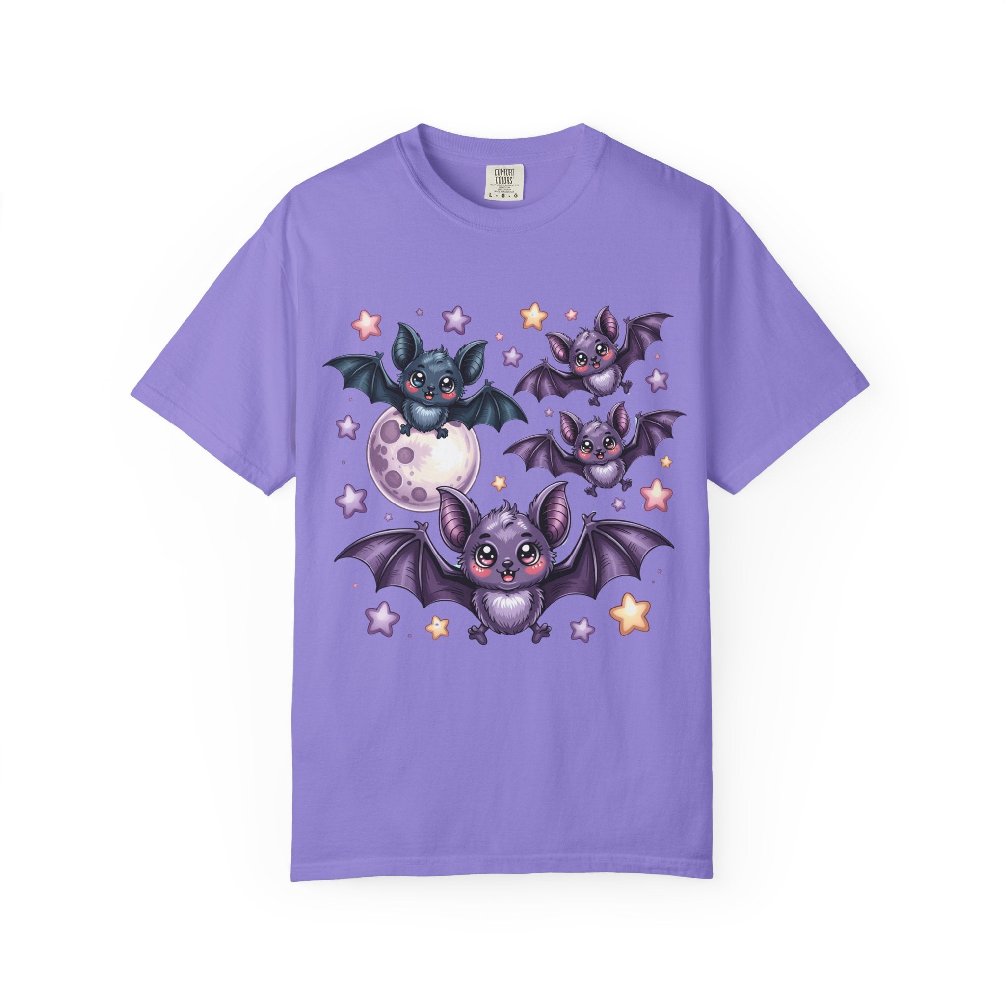 A purple short-sleeve crewneck t-shirt featuring a cartoon graphic of four cute bats flying around a moon and stars, displayed on a clean white background.
