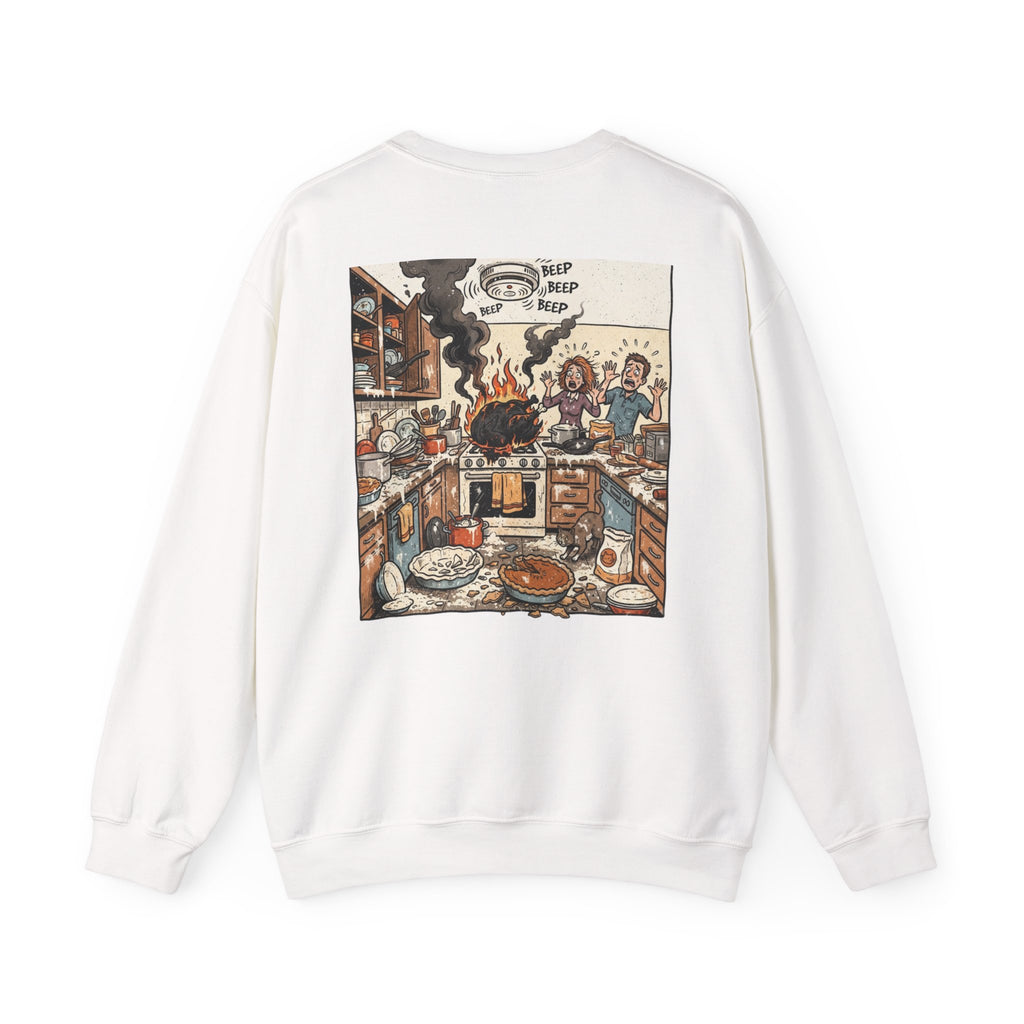 A white crewneck sweatshirt shown from the back, featuring a large, detailed cartoon graphic of a chaotic kitchen scene with the text 'TRIP TRIP TRIP' at the top.