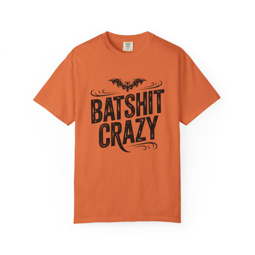 An orange short-sleeve crewneck t-shirt featuring a black graphic print of a bat above the words 'BATSHIT CRAZY' in a stylized font, displayed on a clean white background.