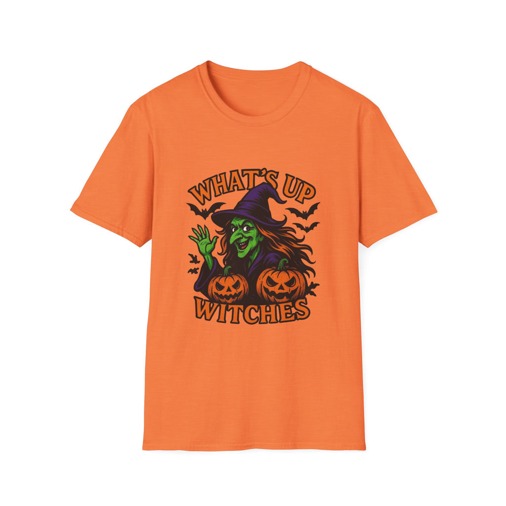 An orange short-sleeve crewneck t-shirt featuring a Halloween graphic of a green witch sitting on jack-o'-lanterns with the text 'WHAT'S UP WITCHES' in orange.