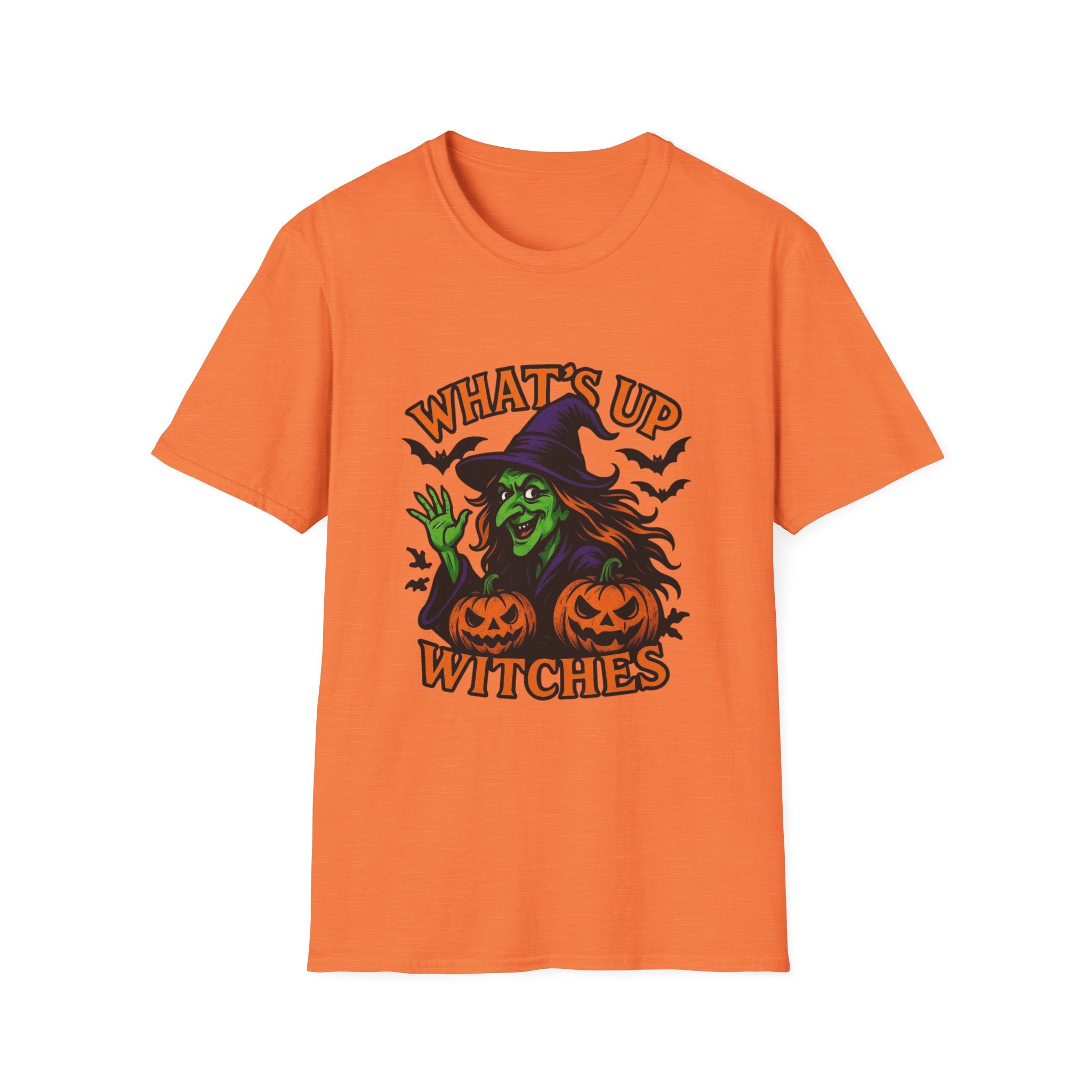 An orange short-sleeve crewneck t-shirt featuring a Halloween graphic of a green witch sitting on jack-o'-lanterns with the text 'WHAT'S UP WITCHES' in orange.