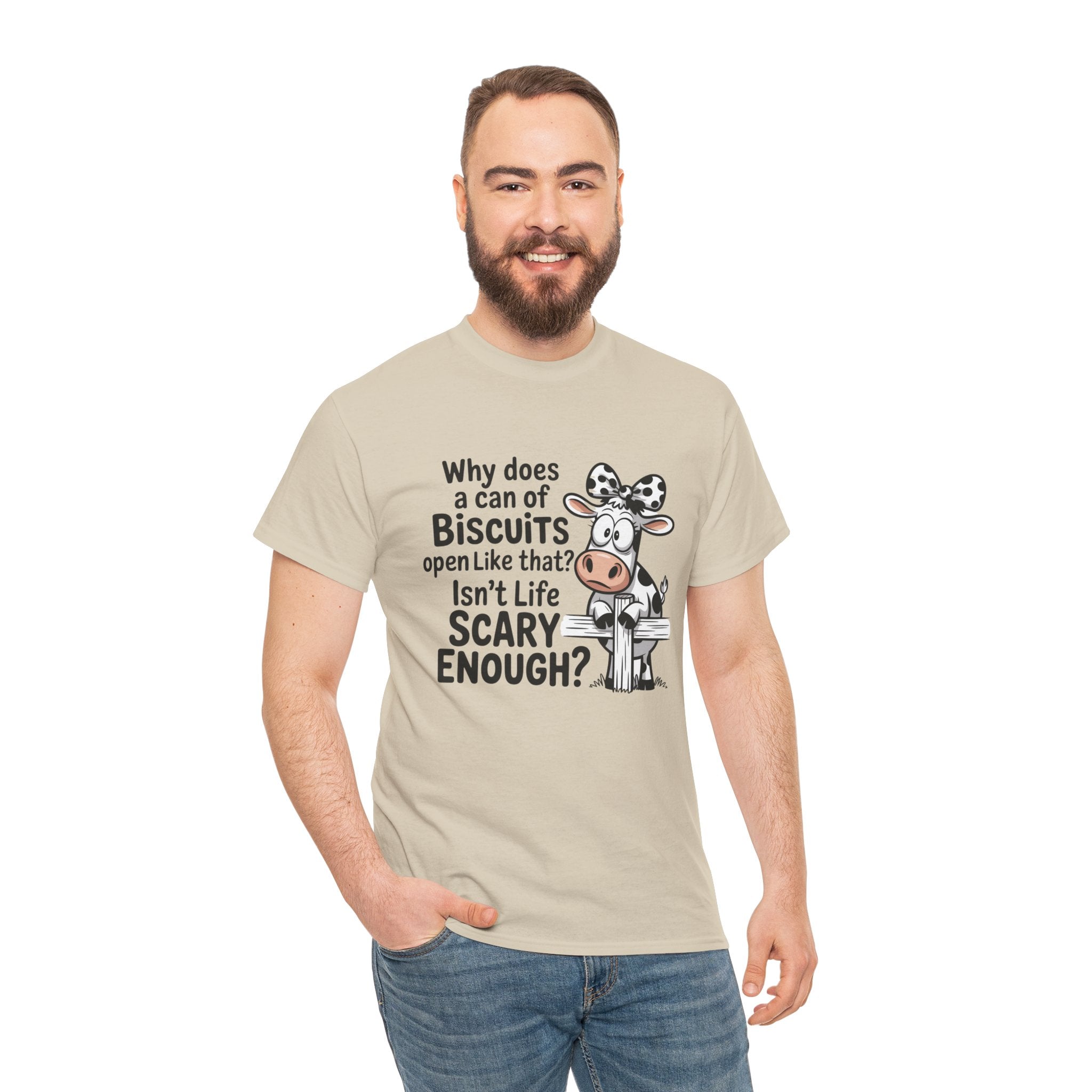 Funny Cow T‑Shirt — "Why does a can of biscuits open like that? Isn't life scary enough?"