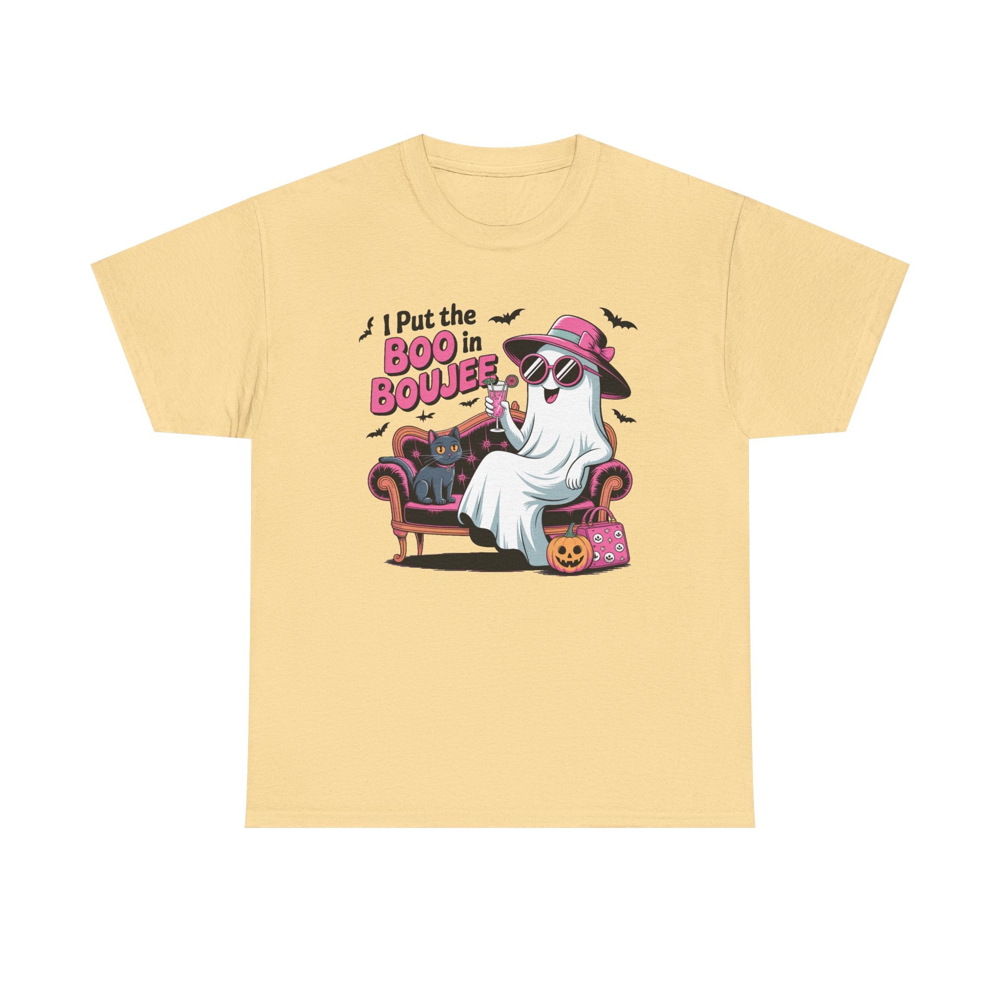 A pale yellow short-sleeve t-shirt with a colorful graphic on the front showing a ghost character in a pink hat sitting on a purple armchair next to a pink pumpkin bag, with the text 'I Put the BOO in BOJEE'.