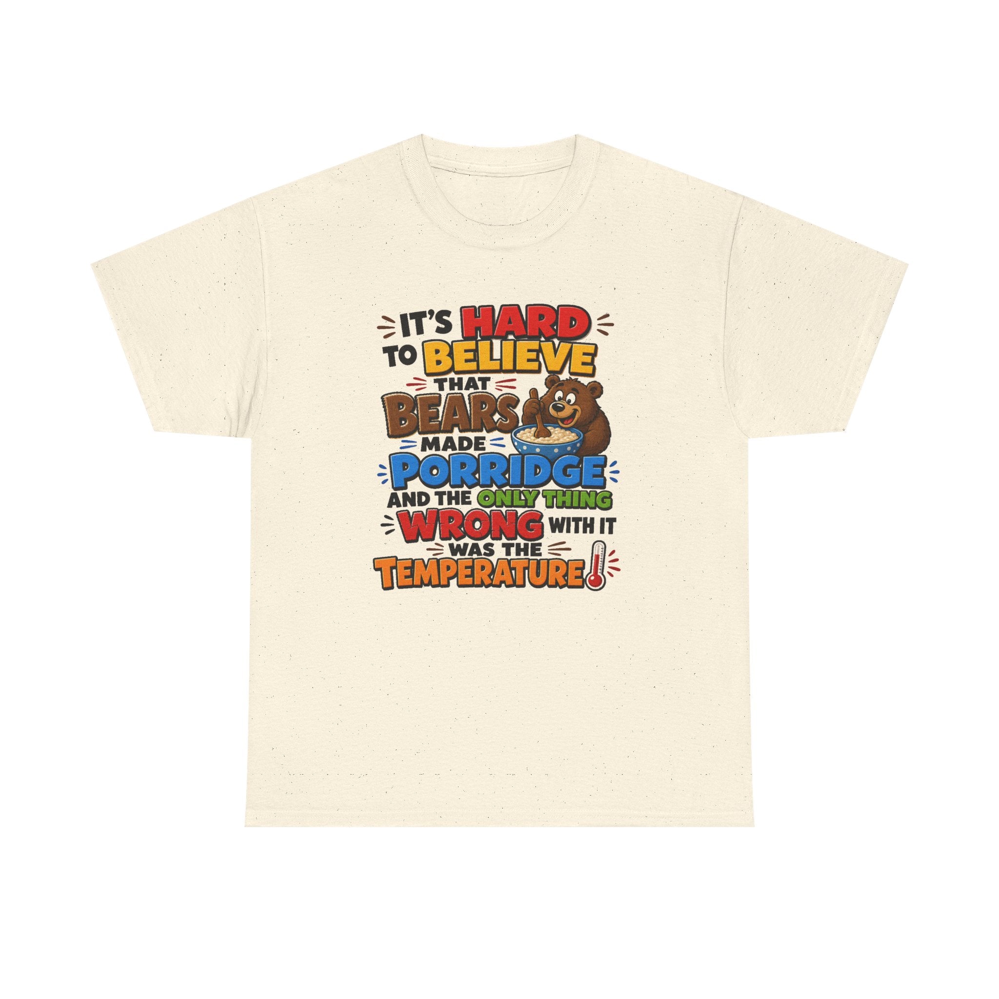 An off-white short-sleeve t-shirt with a colorful graphic print on the front. The graphic features a brown cartoon bear and the text 'IT'S HARD TO BELIEVE THAT BEARS MADE PORRIDGE AND THE ONLY THING WRONG WITH IT WAS THE TEMPERATURE!'.