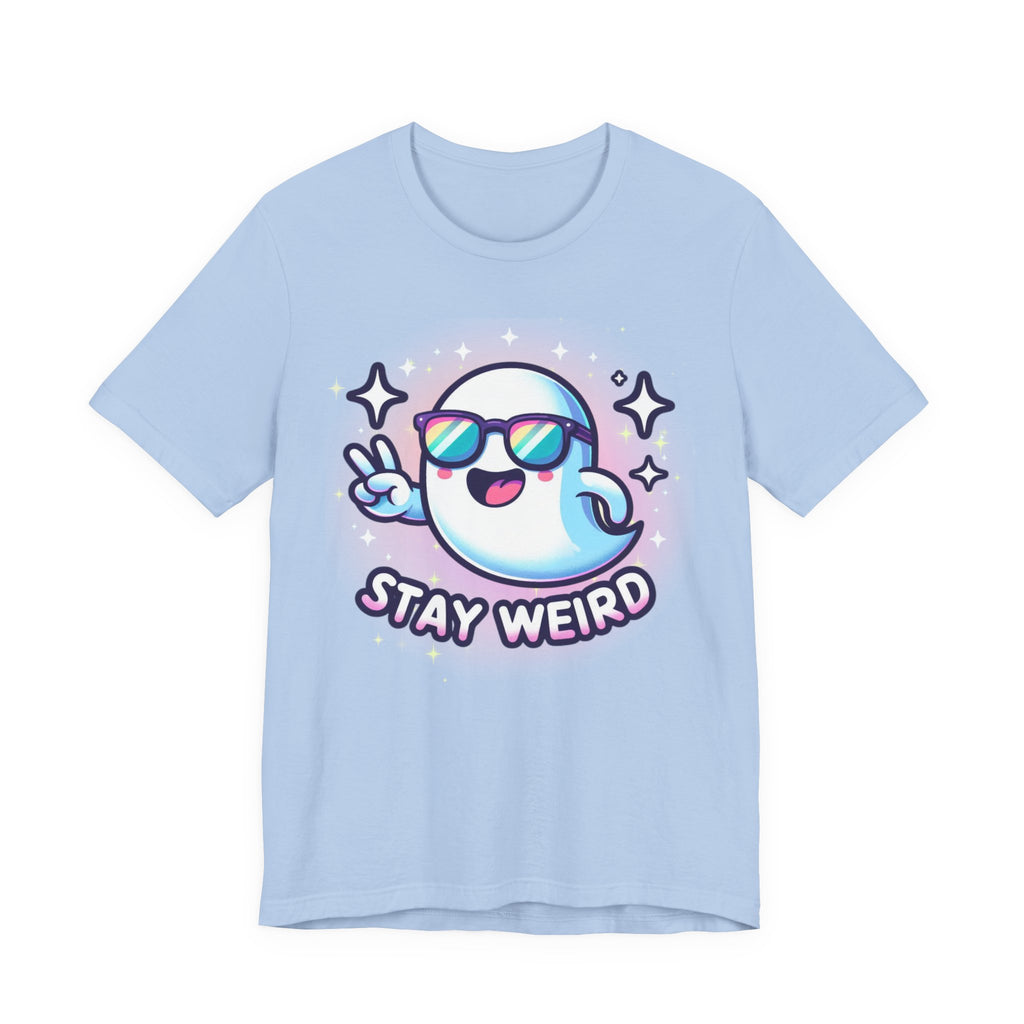 A light blue short-sleeve t-shirt with a cartoon graphic of a ghost wearing sunglasses and making a peace sign, with the text 'STAY WEIRD' below it, on a solid white background.