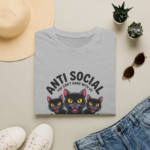 Gray t-shirt with cat graphic and 'Anti Social' text on a beige surface with casual items.