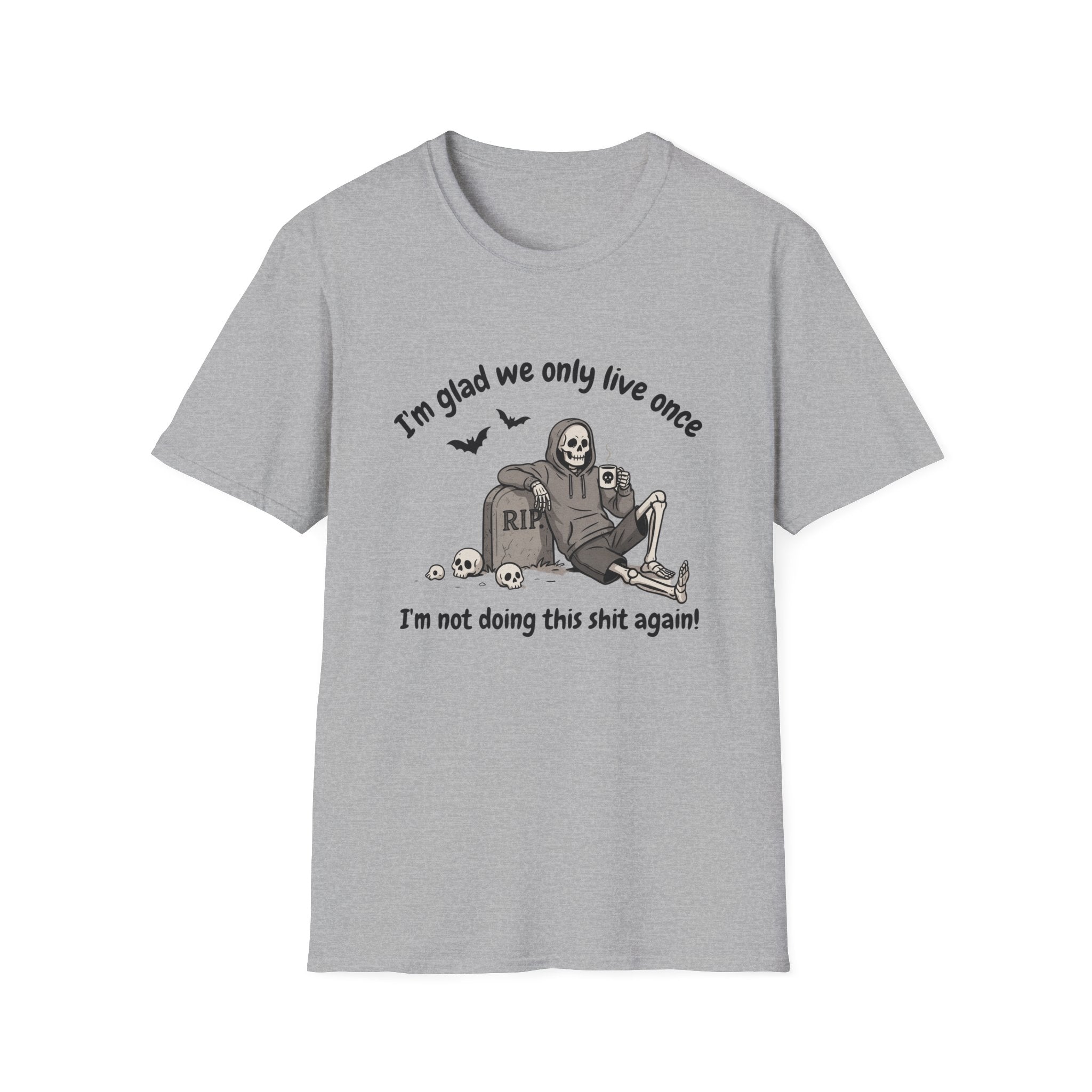 A light gray heather crewneck t-shirt featuring a Halloween-themed graphic of a skeleton sitting on a tombstone with the text 'I'm glad we only live once' and 'I'm not doing this shit again!'.