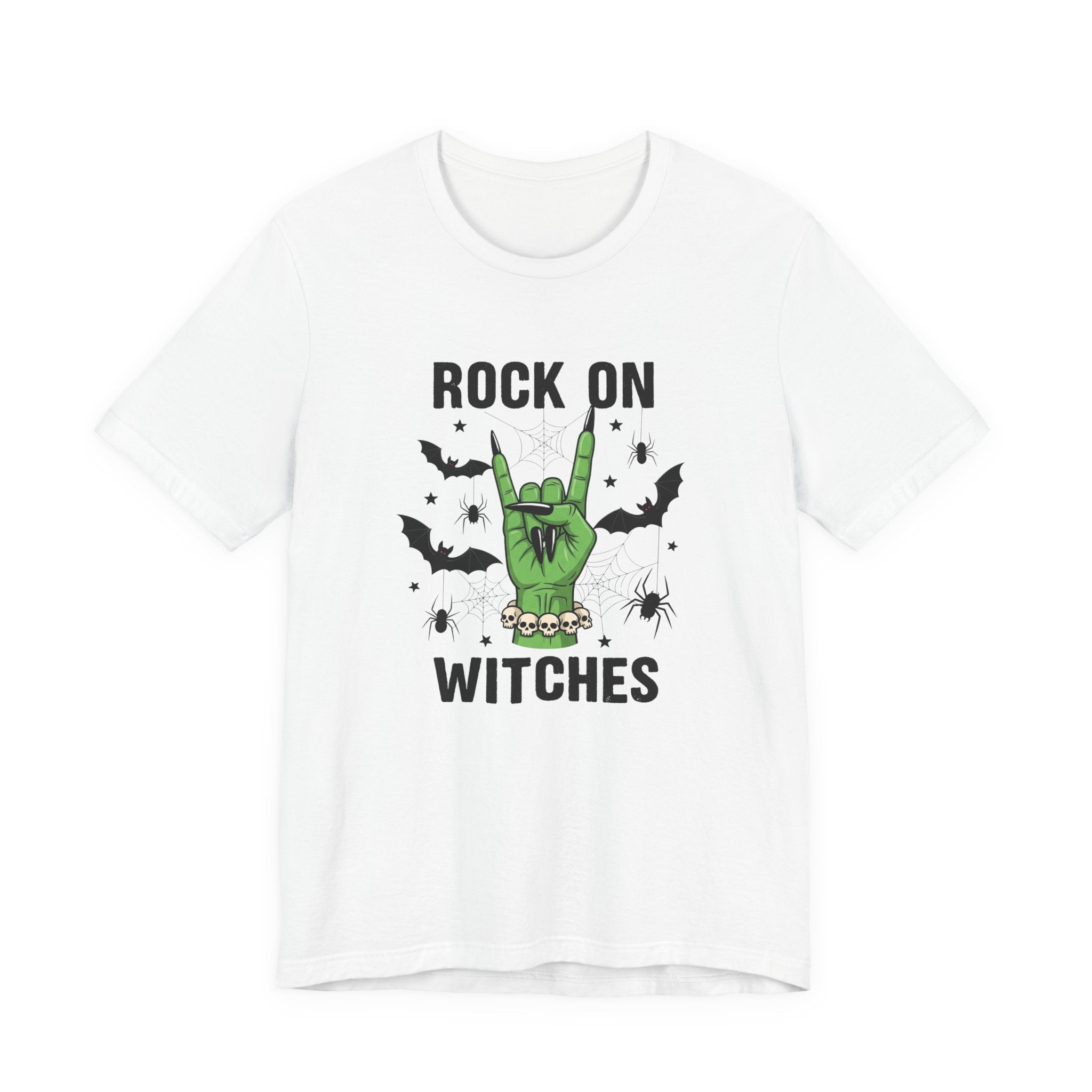 A white short-sleeve crewneck t-shirt featuring a Halloween graphic on the front. The graphic displays a green hand making a rock gesture, surrounded by black bats, a spider, and cobwebs, with the text 'ROCK ON WITCHES' printed in black above and below the illustration.