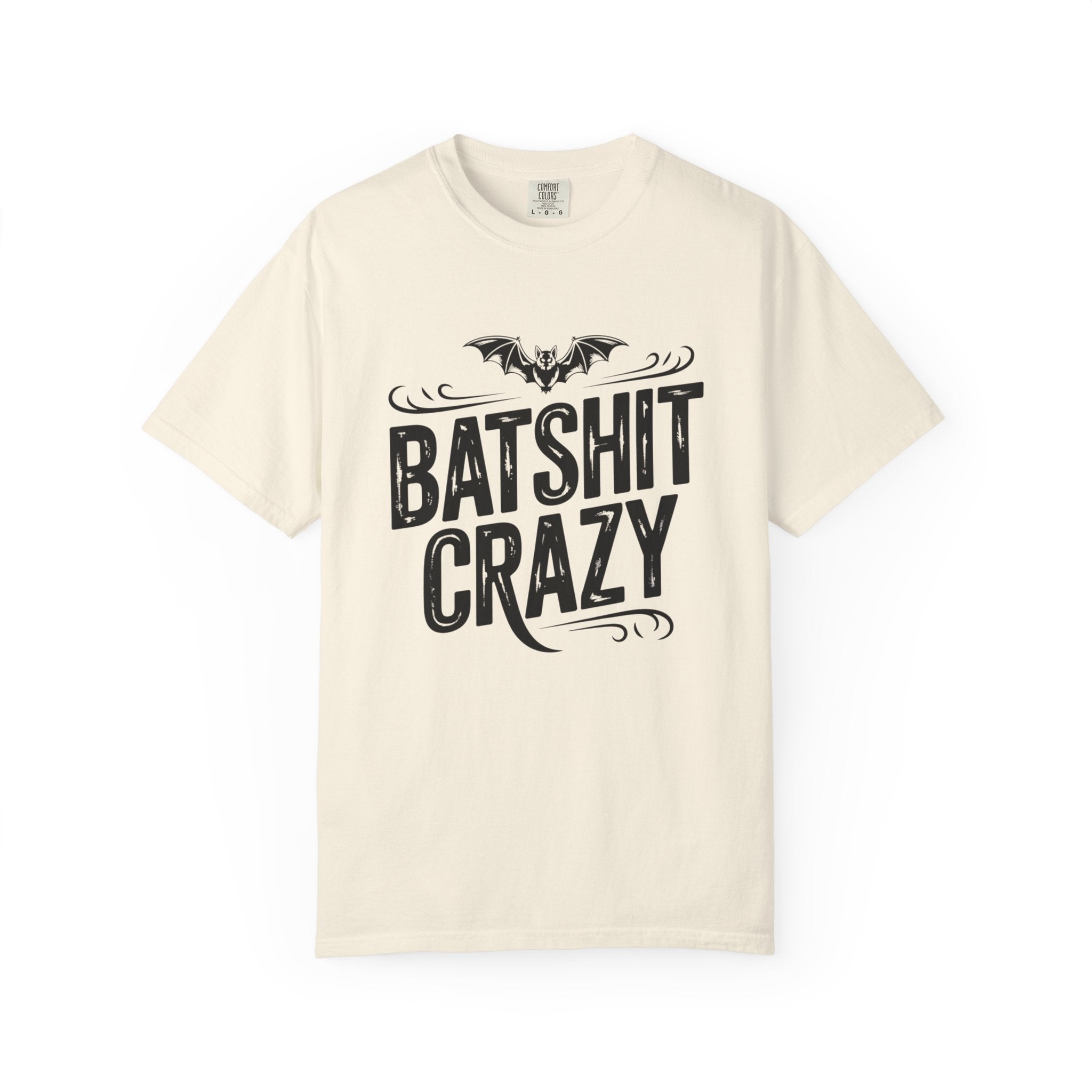 An off-white short-sleeve crewneck t-shirt featuring a black graphic print on the front with a bat illustration and the text 'BATSHIT CRAZY' in a stylized font.