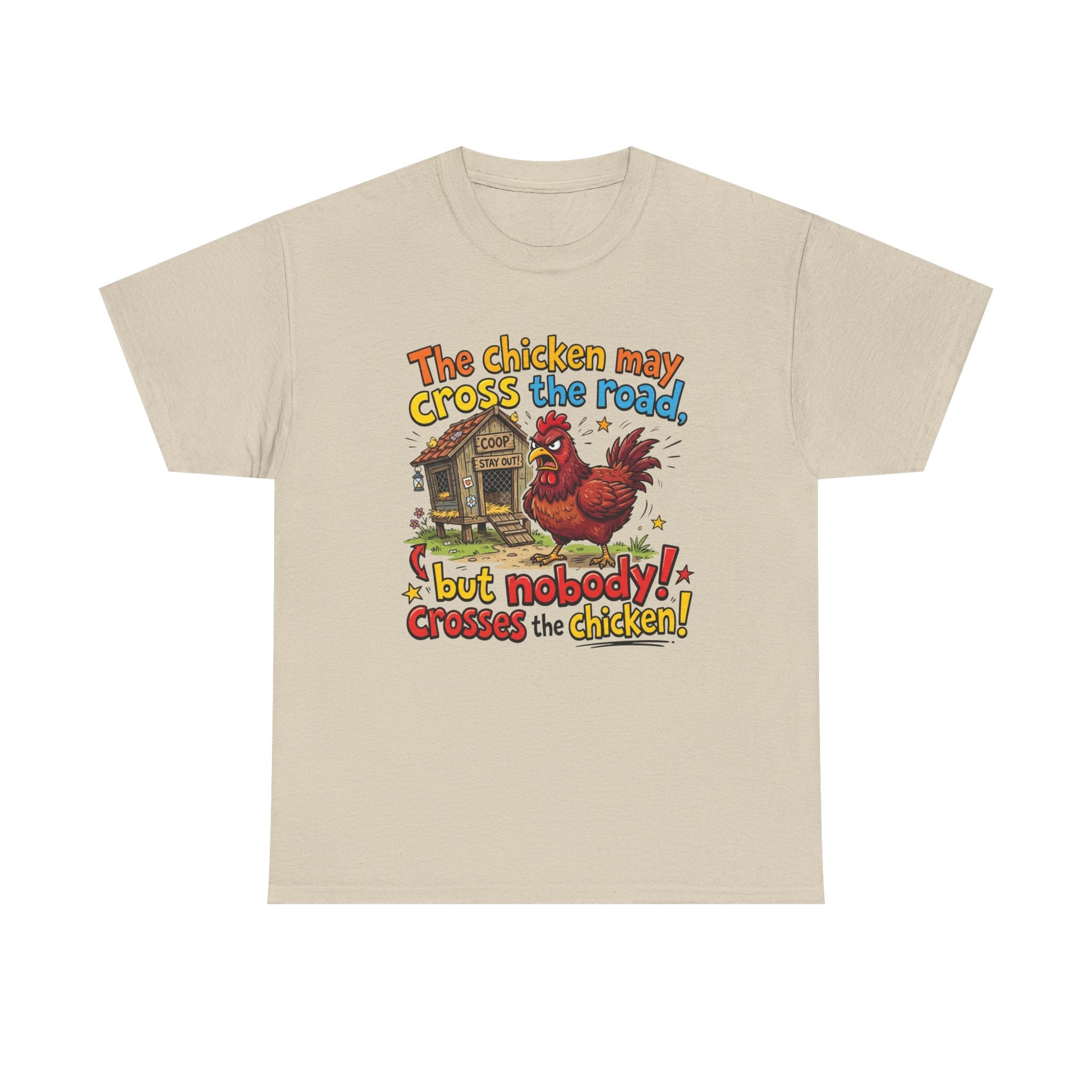 A light beige crewneck t-shirt featuring a colorful graphic print of a rooster and a chicken coop with the text 'The chicken may cross the road but nobody! crosses the chicken!'.